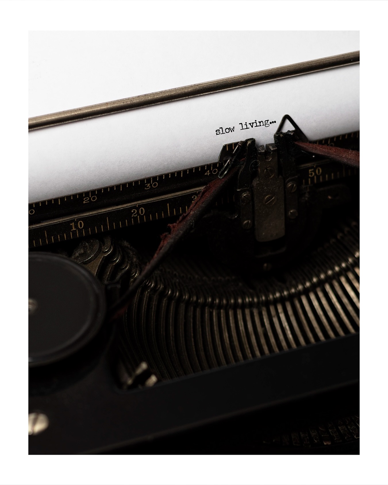 Vintage typewriter typing the words slow living