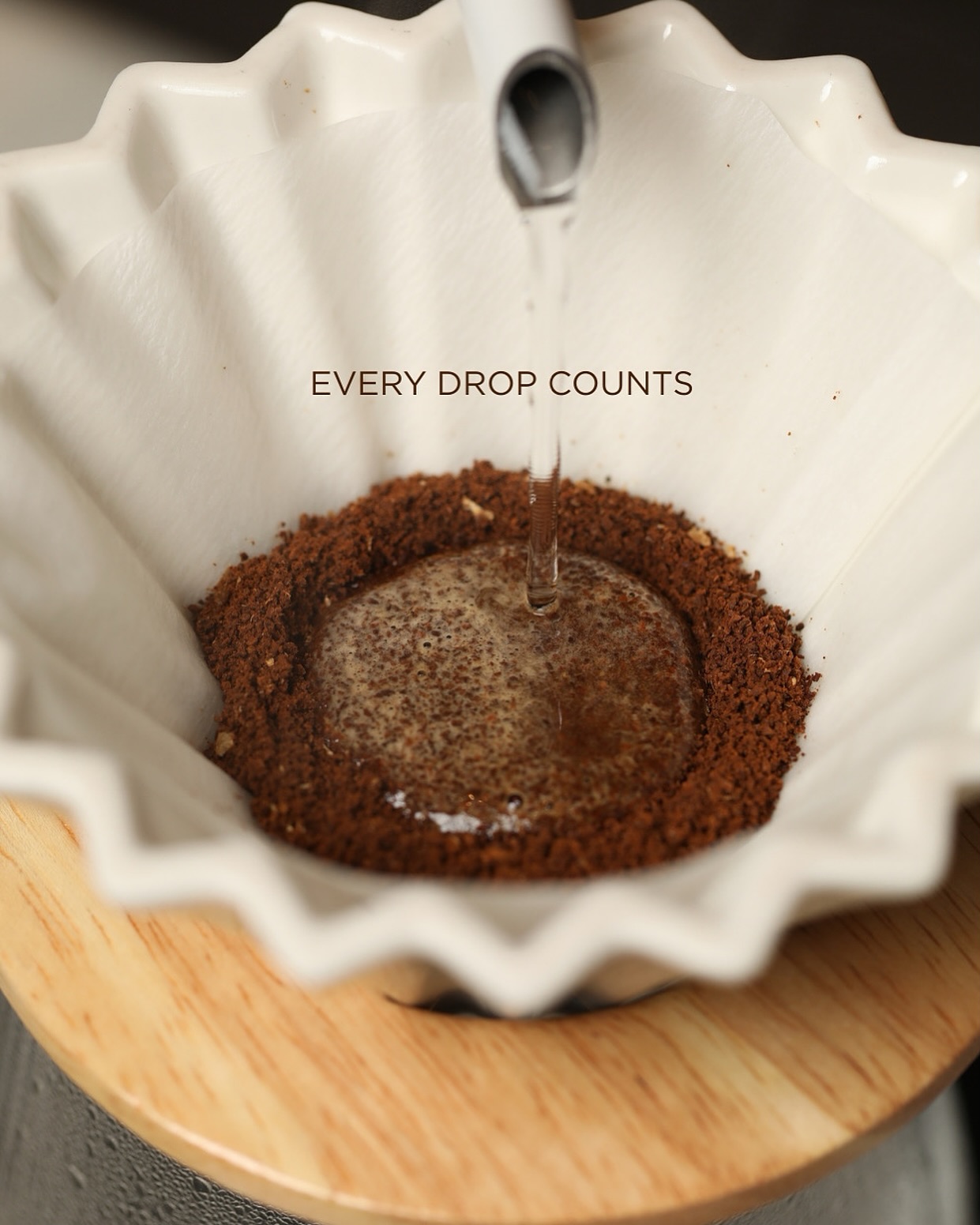 Kalita pour-over brewing with the words every drop counts